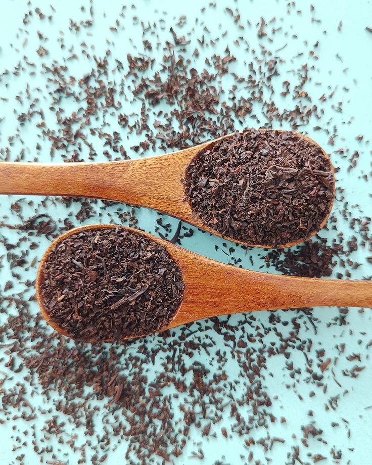Grade A Kenyan tea with carved wooden tasting spoon