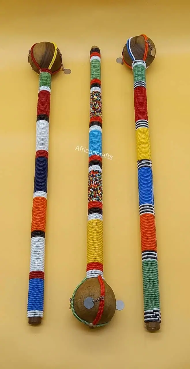 Set of three beaded wooden rungu clubs